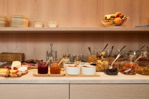 a buffet of food on a counter in a kitchen at C-Hotels Burlington in Ostend