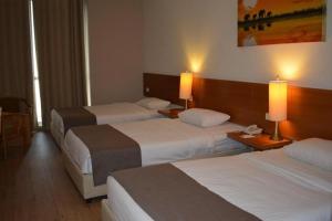 Letto o letti in una camera di Caesar Hotel Ramallah