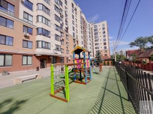 a playground with a play set on a city street at RentHouse Apartments Perla in Chişinău