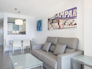 a living room with a couch and a table at Apartamentos Hipocampos Calpe Rent Apart in Calpe