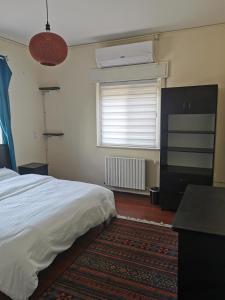 Postel nebo postele na pokoji v ubytování Ramallah Hostel