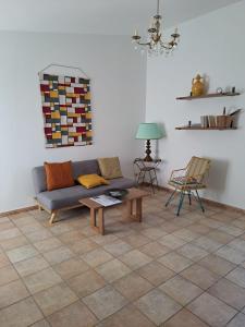 a living room with a couch and a table at Trulli Cibelis in Noci