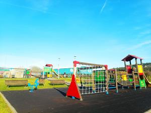 a park with a playground with a play equipment at Apartamento Dúplex en Boo de Piélagos in Puente Arce