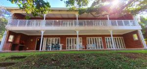 a large brick house with a balcony on top of it at Beach Haven - Sleeps 10 - Tastefully Furnished Holiday Home! in Margate