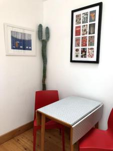a table and two chairs in a room with a cactus at Namastay at Longacre in Woodland