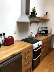 a kitchen with a stove and a counter top at Namastay at Longacre in Woodland