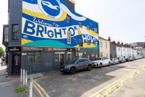 a large sign on the side of a building at Albion at the Level - 2 BD Flat in Brighton & Hove