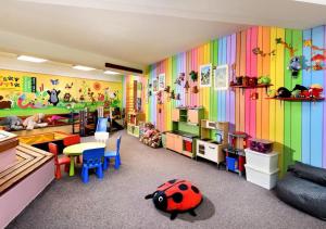 a childrens room with a colorful rainbow wall at Hotel Liptov in Demanovska Dolina