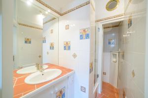 a bathroom with a sink and a shower at La Tour Des Remparts in Rochemaure