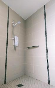 a shower with a shower head in a bathroom at Benbulben View F91YN96 in Sligo