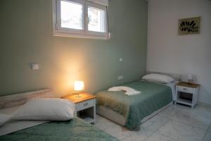 Postel nebo postele na pokoji v ubytování Comfort House Mimosa 1