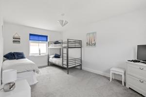 Beach Front House客房内的一张或多张床位