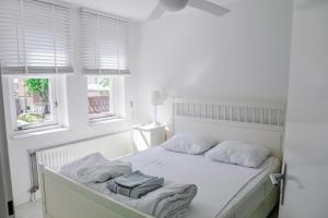 Postel nebo postele na pokoji v ubytování Vakantiewoning op het sluisplateau 23 Wemeldinge