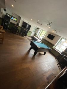 a large room with a pool table in it at Hampton Hotel & restaurant in Llandrindod Wells
