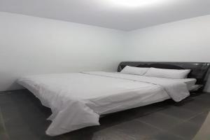 Ένα ή περισσότερα κρεβάτια σε δωμάτιο στο SPOT ON 92616 As-sakinah Syariah