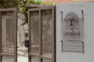 a sign for a library with a tree on it at Lotusland, a relaxing house at Amari Rethymno in Agia Fotini