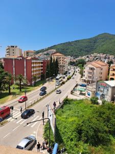 a view of a city street with cars and buildings at Magical View in Budva