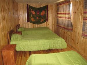 Кровать или кровати в номере Hostal Austral