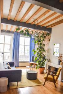 a living room with a couch and a table at Number 9 holiday apartments in Middelburg
