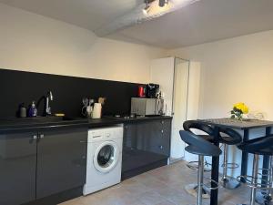 Kuchyň nebo kuchyňský kout v ubytování Appartement de caractère