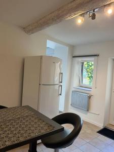 Kuchyň nebo kuchyňský kout v ubytování Appartement de caractère