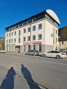 a shadow of a person standing in front of a building at Room near City Center Harbour in Tallinn