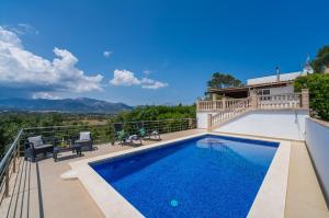 a swimming pool on the balcony of a house at Ideal Property Mallorca - Es Claperas in Inca