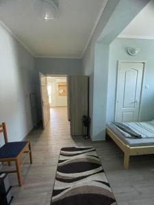 A bed or beds in a room at ALFA Szálláshely