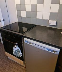 a kitchen with a stove with a sticker on it at Lovely One bedroom Aprt in central London in London
