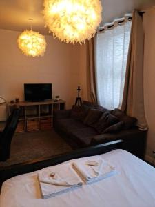 a living room with a couch and a bed and lights at Lovely One bedroom Aprt in central London in London