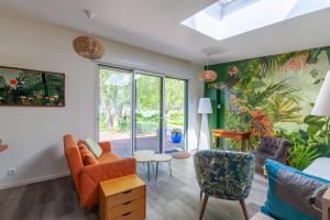 an open living room with a skylight at La Halte des Miquelots - Appt avec jardin in Vains