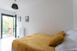 Ein Bett oder Betten in einem Zimmer der Unterkunft Évasion Bleue - Appt vue sur la montagne