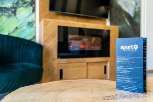Televízia a/alebo spoločenská miestnosť v ubytovaní Apartament Górska Polana by Apart Concept Podhale