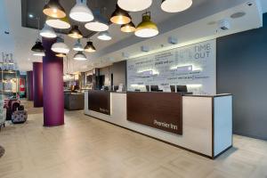 a restaurant with a counter in a store at Premier Inn Berlin Alexanderplatz in Berlin