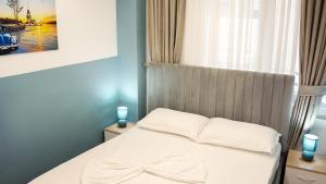 Postel nebo postele na pokoji v ubytování Hotel Luris