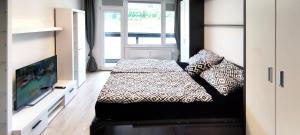 Posteľ alebo postele v izbe v ubytovaní Útulný apartmán v centru, s krásným výhledem
