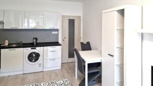 Kuchyňa alebo kuchynka v ubytovaní Útulný apartmán v centru, s krásným výhledem