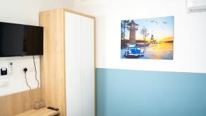 TV a/nebo společenská místnost v ubytování Hotel Luris