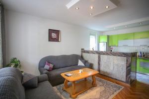 a living room with a couch and a table at Apartment Hercegovina in Mostar