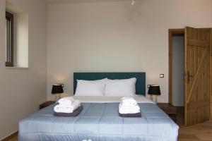 A bed or beds in a room at Kika Residences