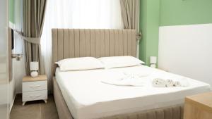 Postel nebo postele na pokoji v ubytování Hotel Luris