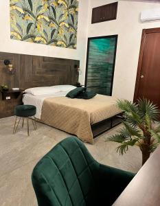En eller flere senger på et rom på Nid’Amour suite&spa