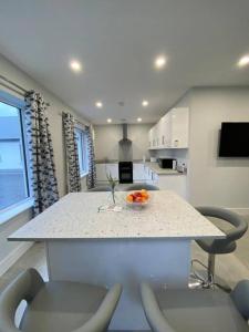 a kitchen with a counter with a bowl of fruit on it at Ard na Gréine in Stradbally