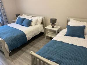 Postel nebo postele na pokoji v ubytování Ard na Gréine