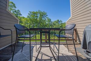 a table and two chairs on a patio at Live a Little in McHenry