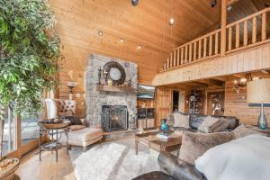 a living room with a stone fireplace in a house at Happyplace Hideaway in McHenry