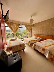 Postel nebo postele na pokoji v ubytování Hotel Rumi Wasi