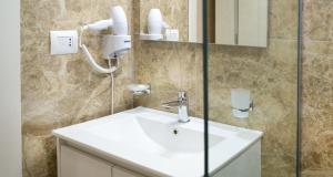Koupelna v ubytování Hotel Luris