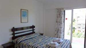 Postel nebo postele na pokoji v ubytování Apartamentos Flandria + 20 fotografií