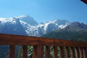 a view of the mountains from a deck at Orion chalet facing the Meije - 10 persons in La Grave